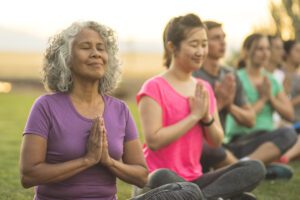 A person practicing mindfulness and relaxation techniques, such as yoga, meditation, or deep breathing exercises. This image illustrates the importance of self-care in managing anxiety.